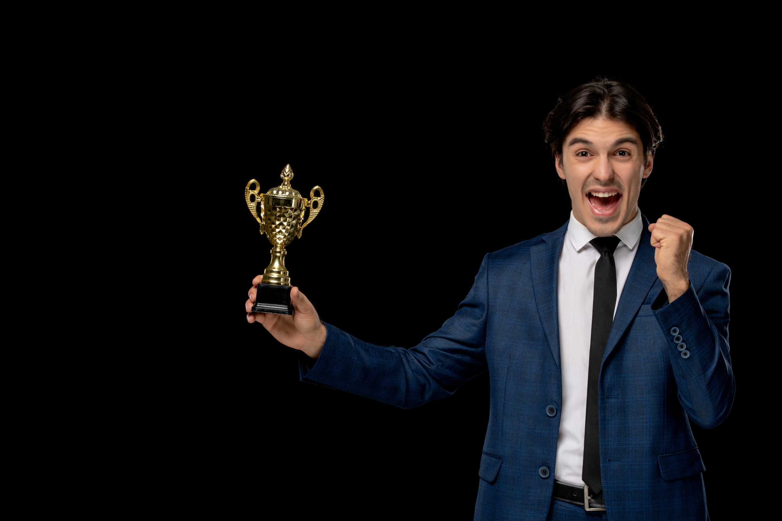 business-man-cute-excited-man-dark-blue-suit-with-tie-holding-trophy